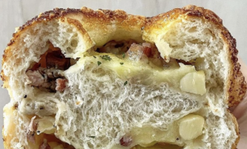Melty cheese in a baked bread roll
